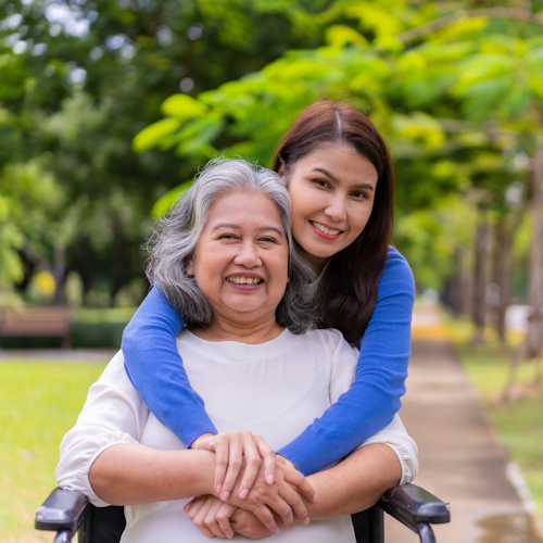 Young woman with older woman in wheelchair