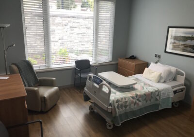 Hospice bedroom with large garden window